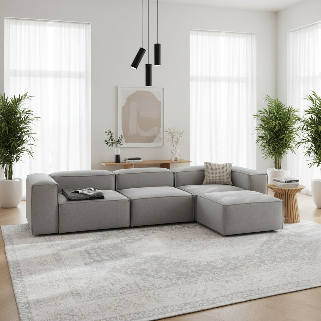 Alpha modular 3 seater with matching stool, finished in soft neutral upholstery for a cohesive, balanced look
