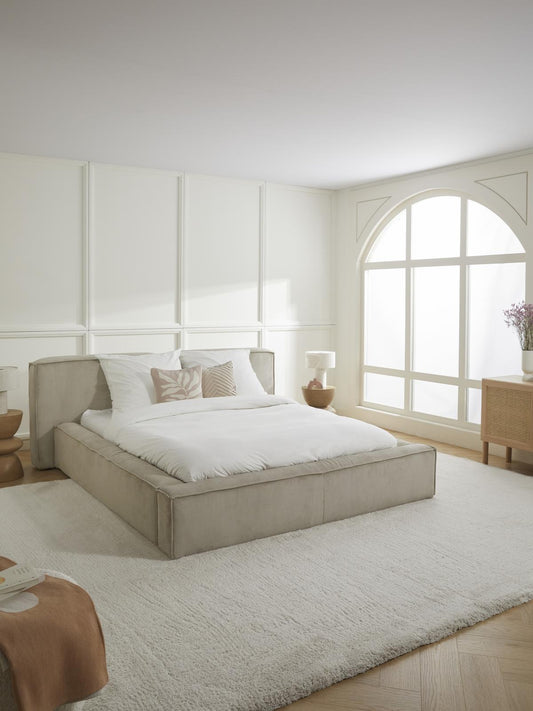 luxury bed with refined fabric upholstery and clean lines