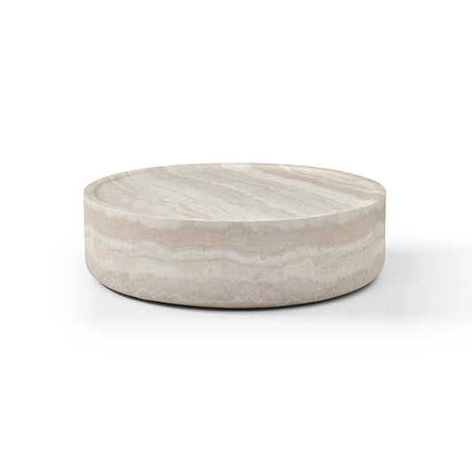 The Cilano Medium Sofa Table is shown in a clean studio view on a white background, highlighting its rounded form and faux travertine finish.