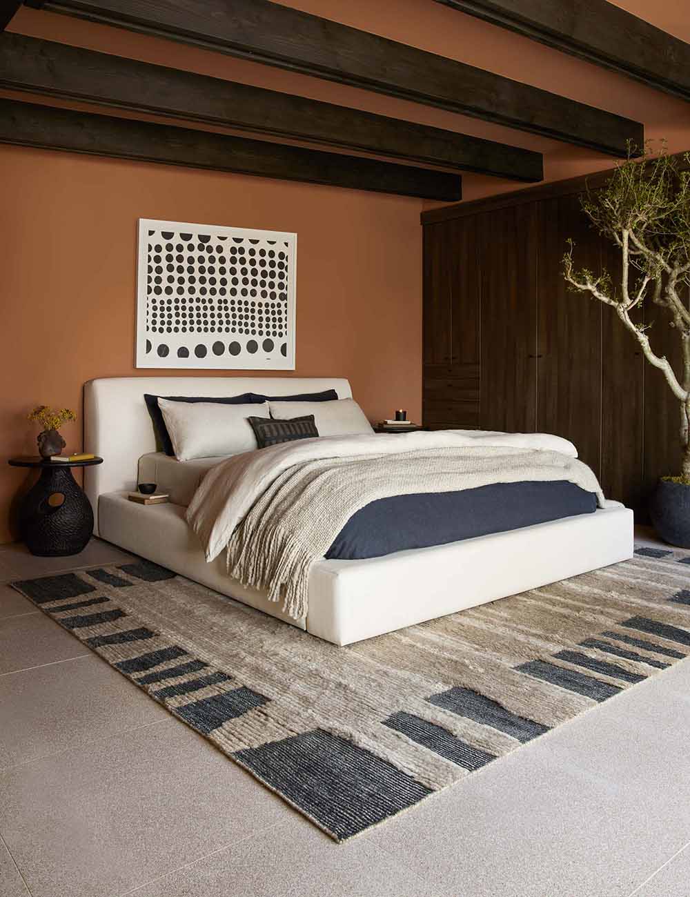 contemporary bed with padded design and smooth fabric