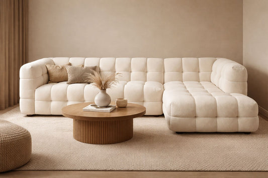 A refined, sculptural centrepiece in soft bouclé, designed with deep channel tufting and a seamless contemporary silhouette.