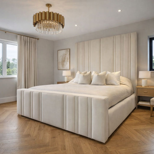 Modern bedroom with a large bed, decorative headboard, and stylish lighting fixture.