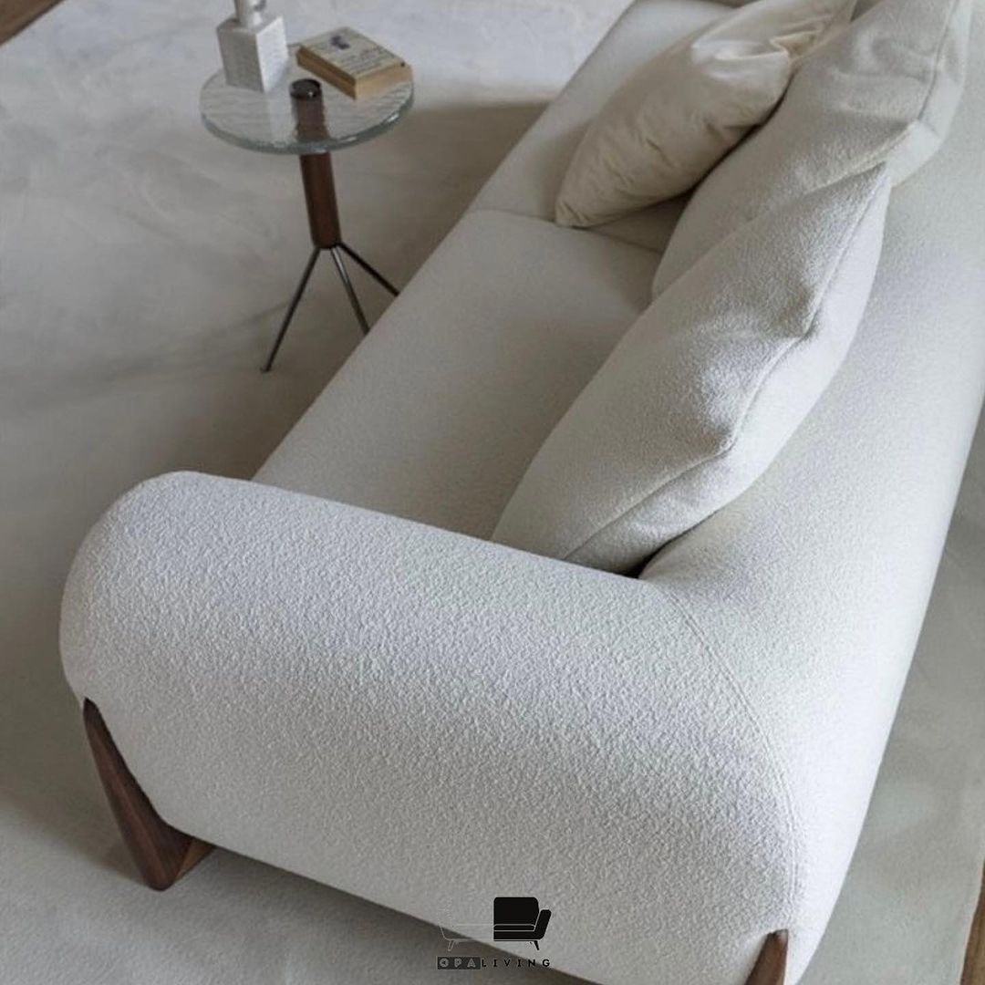 cream sofa with wooden legs