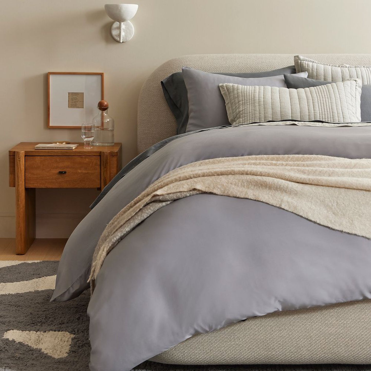 contemporary upholstered bed with simple refined headboard