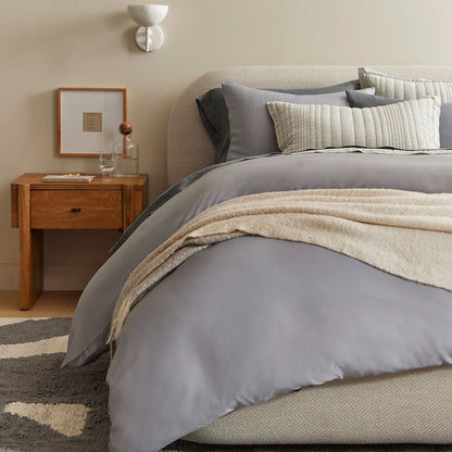 contemporary upholstered bed with simple refined headboard