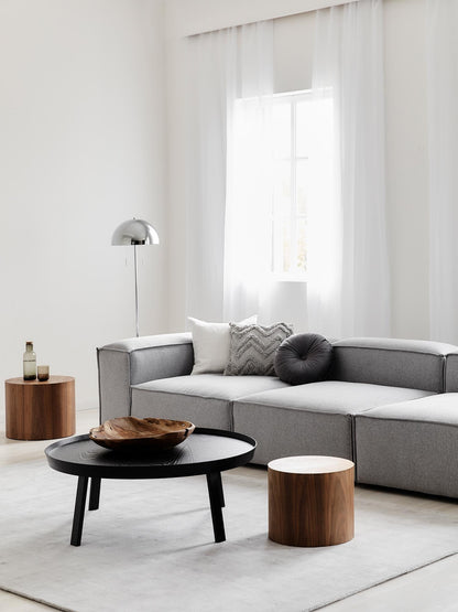 Luxury Alpha 3 seater sofa with soft edges, textured fabric, and sculptural form, styled with contemporary furniture for a high-end interior
