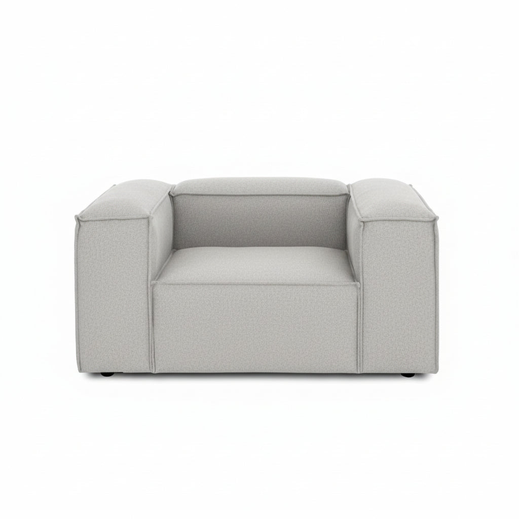 A clean, contemporary armchair featuring a structured silhouette and refined proportions for modern interiors.