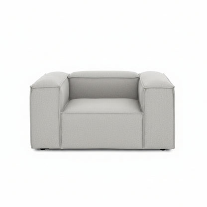 A clean, contemporary armchair featuring a structured silhouette and refined proportions for modern interiors.
