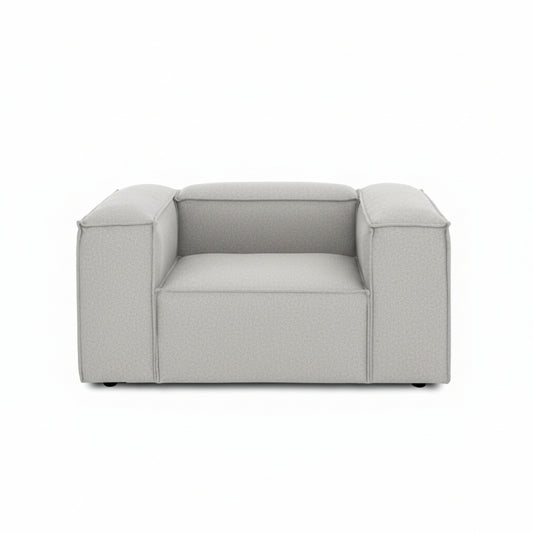 A clean, contemporary armchair featuring a structured silhouette and refined proportions for modern interiors.