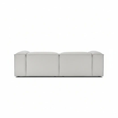 Alpha 2 seater sofa with chaise end in neutral fabric, featuring a low-profile modular design with clean line