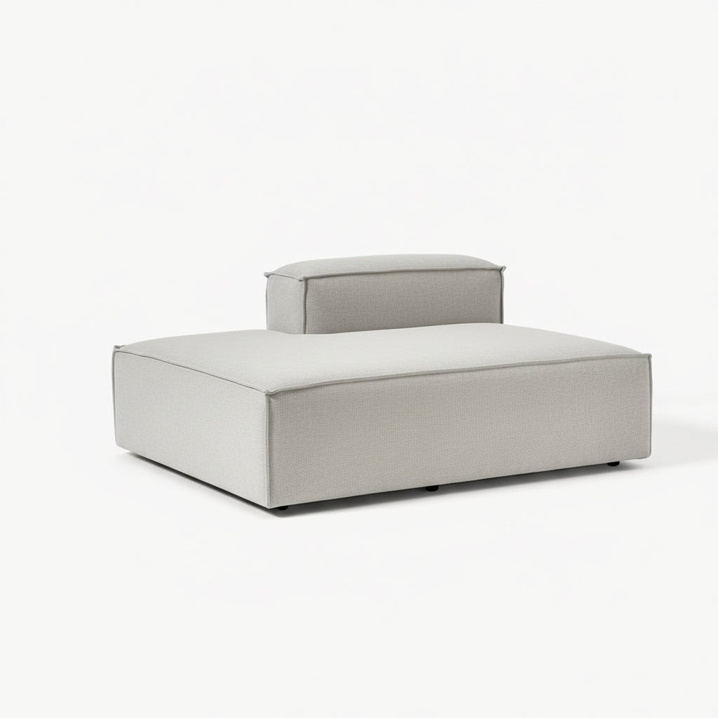 A clean, elongated ottoman with a structured silhouette, designed to extend seating and enhance modular sofa configurations with modern simplicity.