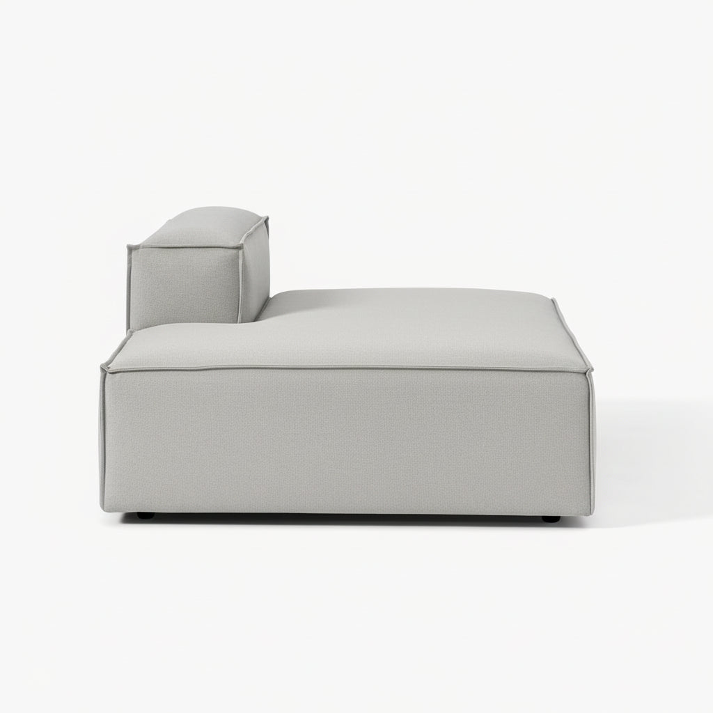 A clean, structured chaise unit with an integrated backrest, designed to extend comfort while maintaining a sleek, contemporary modular aesthetic.