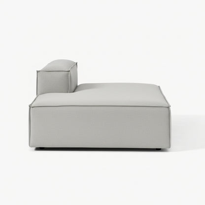 A clean, structured chaise unit with an integrated backrest, designed to extend comfort while maintaining a sleek, contemporary modular aesthetic.