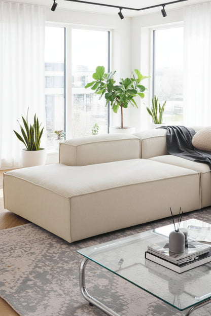 A clean, structured corner chaise designed to extend seating while maintaining a sleek, contemporary modular aesthetic.