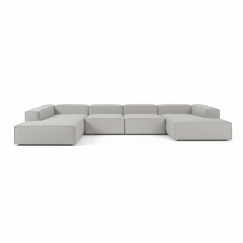 Alpha modular double corner sofa arranged in a wide linear format, offering generous seating with clean, continuous lines
