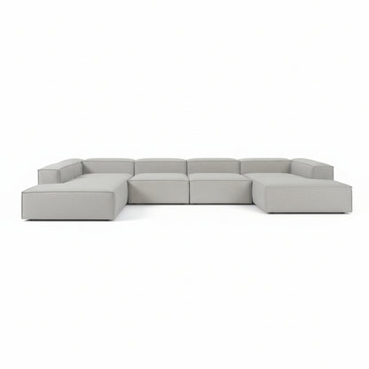 Alpha modular double corner sofa arranged in a wide linear format, offering generous seating with clean, continuous lines
