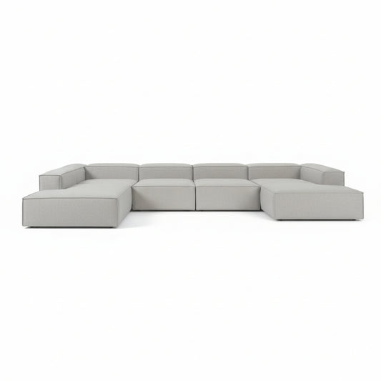 Alpha modular double corner sofa arranged in a wide linear format, offering generous seating with clean, continuous lines
