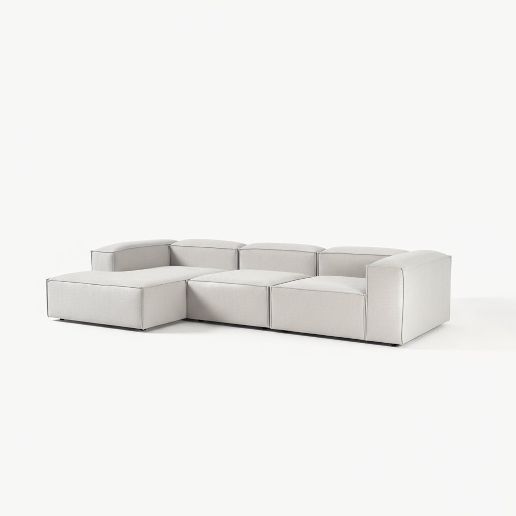 Designer Alpha modular L shape 3 seater sofa in a refined living room setting with plush cushions, neutral tones, and a low-profile modern aesthetic
