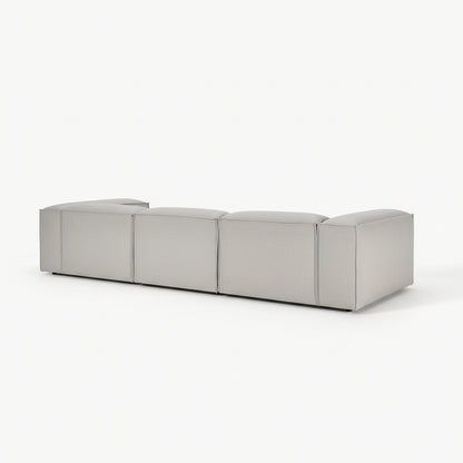 Designer Alpha 3 seater sofa in a spacious contemporary room with natural textures, clean lines, and soft neutral upholstery for an elevated luxury aesthetic
