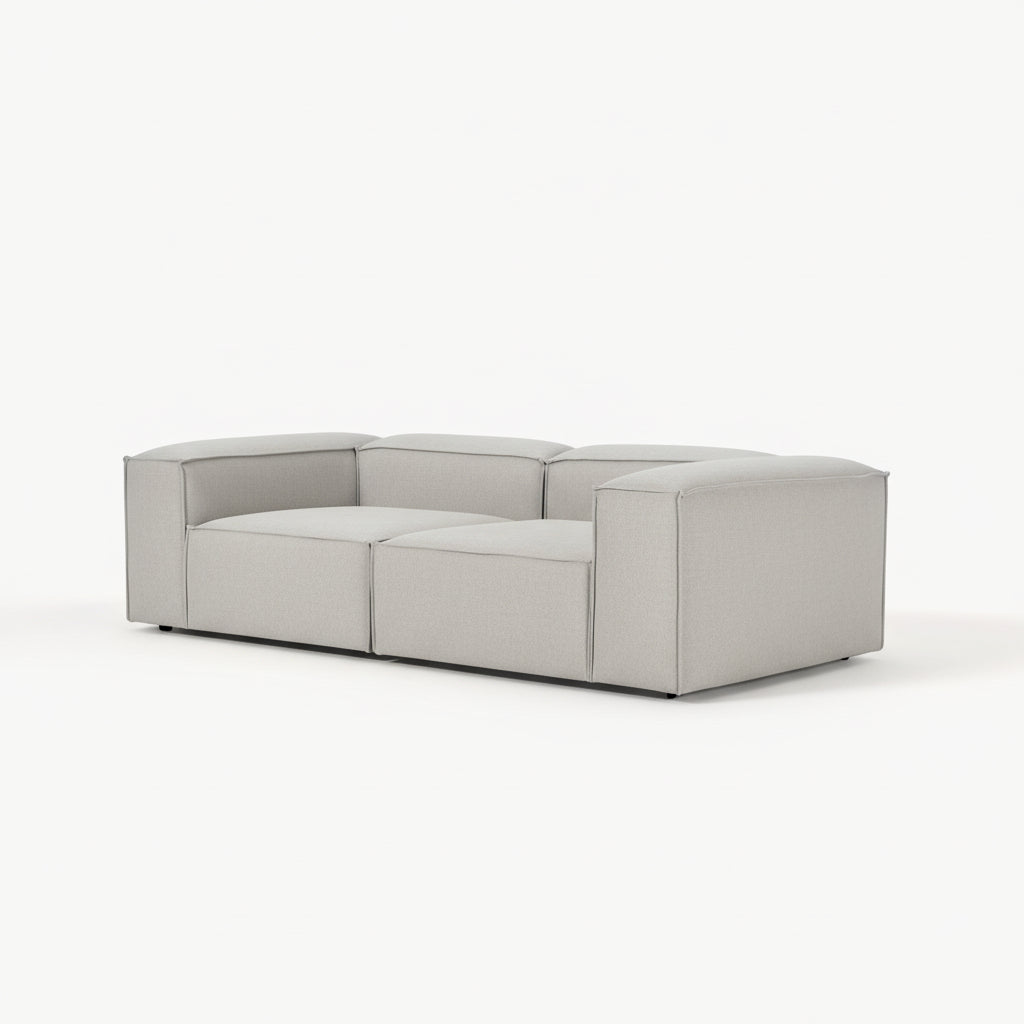 Alpha modular 2 seater sofa with wide seating modules, tailored upholstery, and a low-profile design offering both comfort and a clean modern aesthetic
