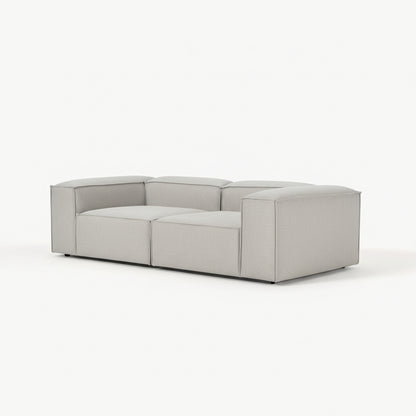 Alpha modular 2 seater sofa with wide seating modules, tailored upholstery, and a low-profile design offering both comfort and a clean modern aesthetic
