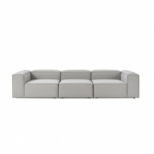 Luxury Alpha modular 3 seater sofa in soft neutral fabric with wide structured seats, low-profile silhouette, and clean contemporary lines for modern interiors
