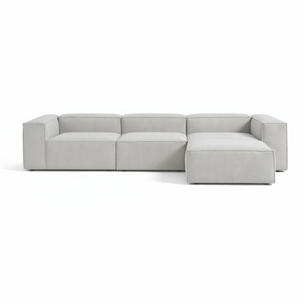 Alpha modular 3 seater paired with a matching stool, featuring a structured shape and deep seating for a relaxed, adaptable layout
