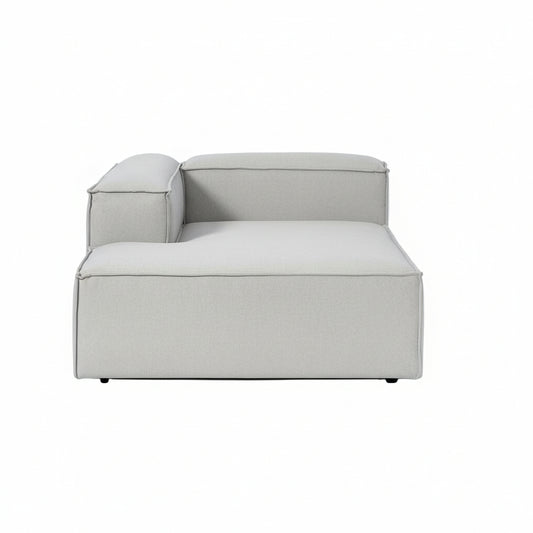 Luxury Alpha modular chaise sofa in neutral textured upholstery with deep seating, clean lines, and contemporary low-profile design for modern living spaces