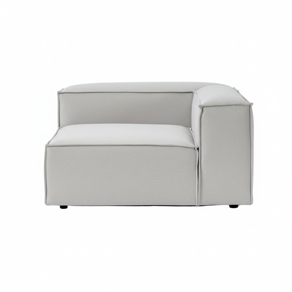 A structured corner module with a defined right arm, designed to seamlessly anchor modular configurations while maintaining a clean, contemporary silhouette.