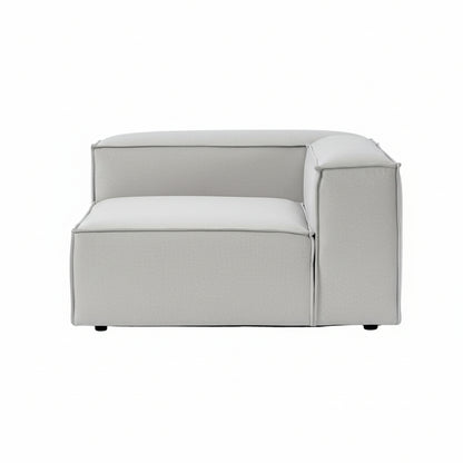 A structured corner module with a defined right arm, designed to seamlessly anchor modular configurations while maintaining a clean, contemporary silhouette.