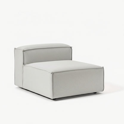 Alpha modular single seat featuring a compact silhouette, supportive cushioning, and soft neutral upholstery for flexible living spaces
