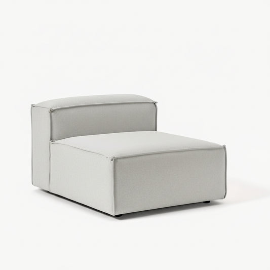 Alpha modular single seat featuring a compact silhouette, supportive cushioning, and soft neutral upholstery for flexible living spaces
