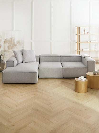 Luxury Alpha modular 3 seater L shape sofa in textured fabric with subtle detailing, deep comfort seating, and a balanced modern design for high-end living spaces