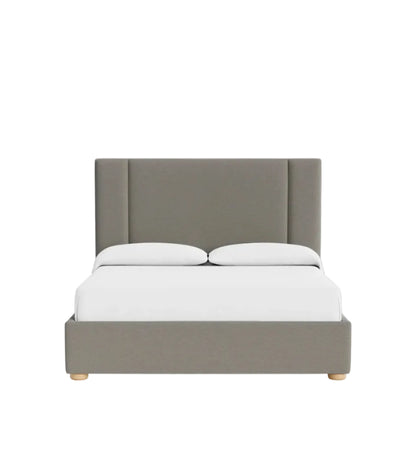 Front view of Ashton bed featuring soft padded headboard panels and minimalist base