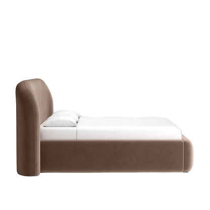designer bed with soft curved edges and upholstered frame
