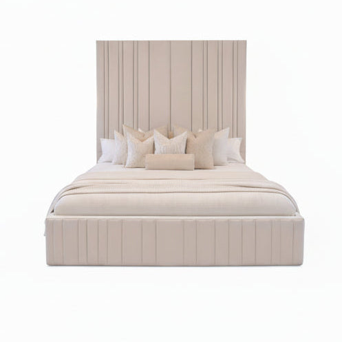modern upholstered bed with structured headboard and soft neutral tone