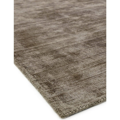 A detailed macro shot highlighting the 100% wool fibres of the Avoria Rug, emphasizing its soft pile, tactile weave, and natural fibre variation against a white studio background.