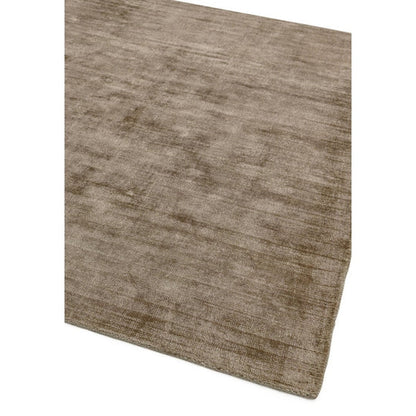 This image focuses on the refined edge finishing of the Avoria Hand Woven Rug, crafted from 100% wool, highlighting durable stitching and handcrafted detailing on a white background.