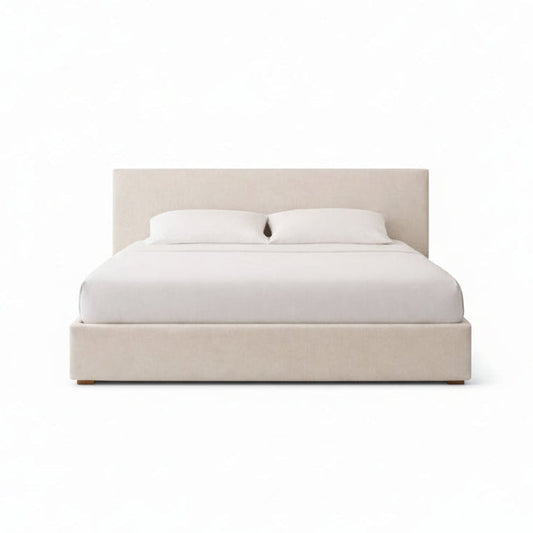 ayra upholstered bed with soft sculpted frame and minimal headboard