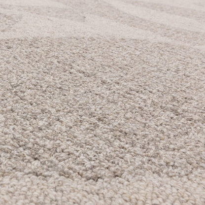 An angled studio shot of the Bellara Rug on a white background, focusing on its 100% wool weave, subtle pattern depth, and natural material variation.