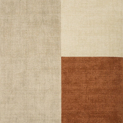 The Bloc Copper Rug is shown in a full top-down view on a clean white background, highlighting its bold geometric colour-block design and contemporary copper tones