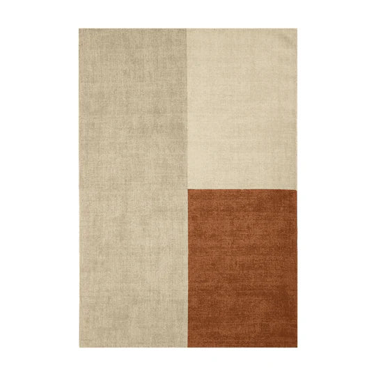 The Bloc Copper Rug is shown in a full top-down view on a clean white background, highlighting its bold geometric colour-block design and contemporary copper tones.
