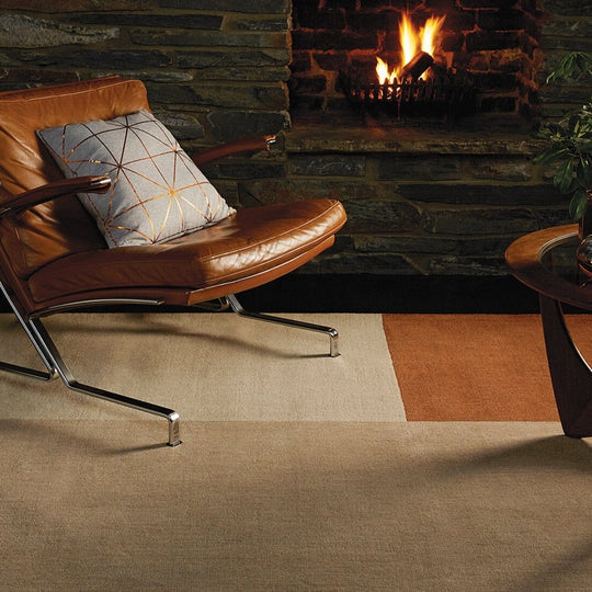 A close-up studio shot showcasing the rug’s striking geometric pattern and contrasting copper tones, emphasizing clean design and modern structure.