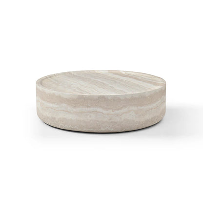 The Cilano Medium Sofa Table is shown in a clean studio view on a white background, highlighting its rounded form and faux travertine finish.