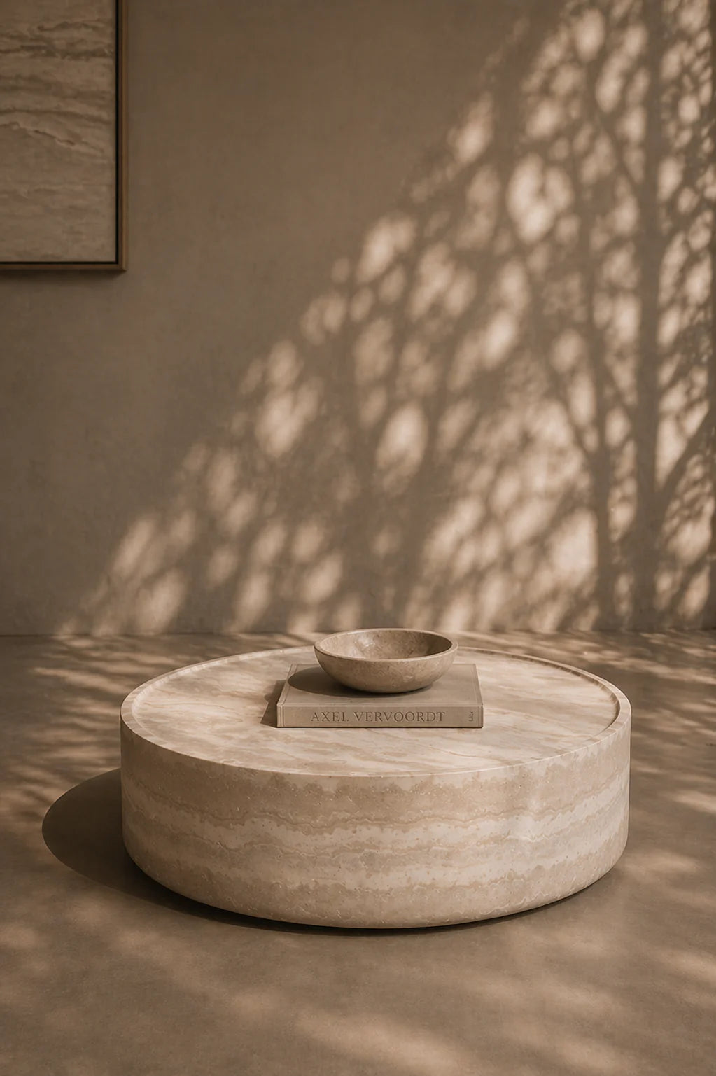A styled interior shot showing the table in a modern living space, demonstrating its versatility and grounding presence.