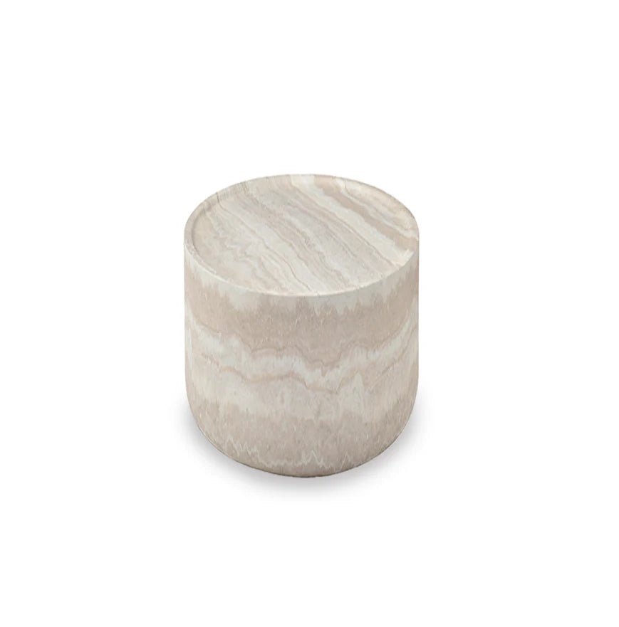 The Cilantro Side Table is shown in a full studio view on a clean white background, highlighting its rounded sculptural form and faux travertine finish.