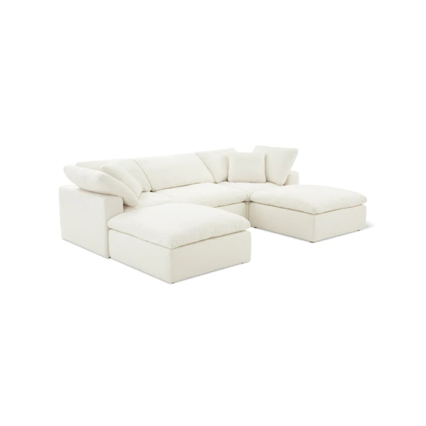 large U shaped sofa with plush cushions and two footstools for extended lounging comfort
