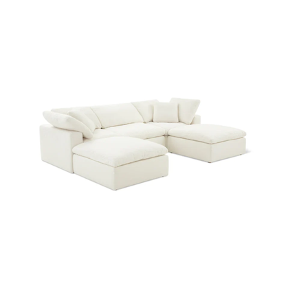 large U shaped sofa with plush cushions and two footstools for extended lounging comfort
