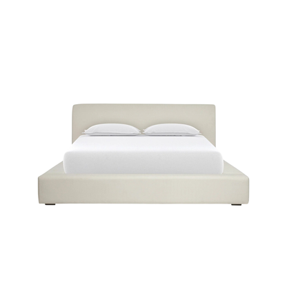 cloud bed with soft padded headboard and plush upholstery