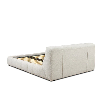 luxury fabric bed with structured headboard and calm bedroom setting